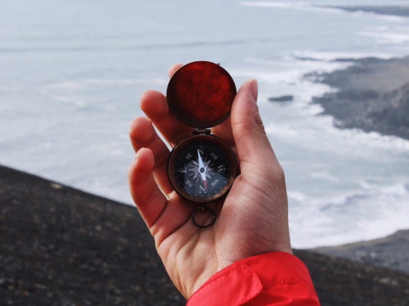 Hand-Holding-Compass-By--1000x1000.png
